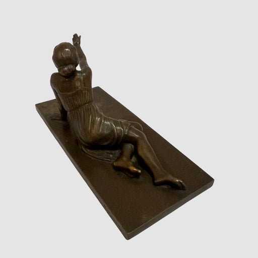 Bronze Statue of A reclined woman with raised hand. - GLen Manor Galleries 